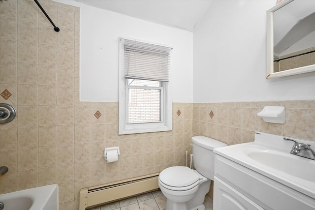 full bath featuring vanity, tile patterned flooring, a baseboard heating unit, tile walls, and toilet