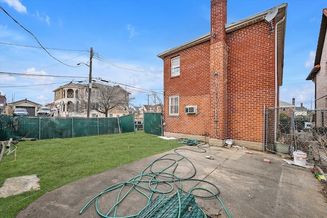 exterior space with a yard and a fenced backyard