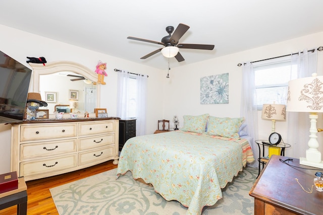 bedroom featuring a ceiling fan and wood finished floors