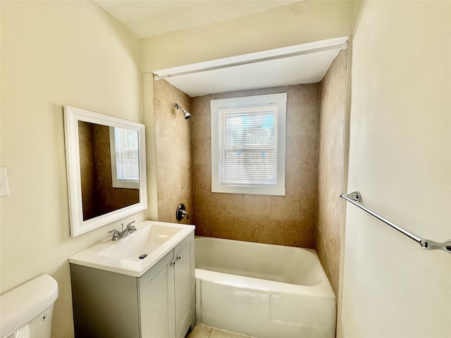 bathroom with vanity, toilet, and shower / bathtub combination