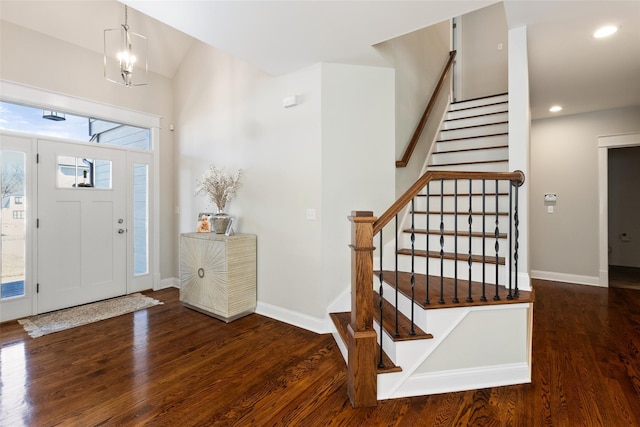 entryway with recessed lighting, an inviting chandelier, baseboards, and wood finished floors