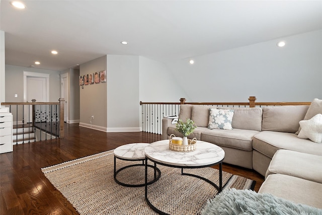 living room featuring recessed lighting, baseboards, and wood finished floors