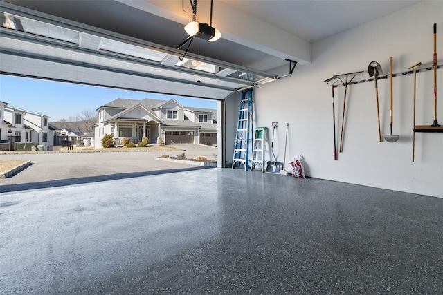 garage featuring a residential view and a garage door opener