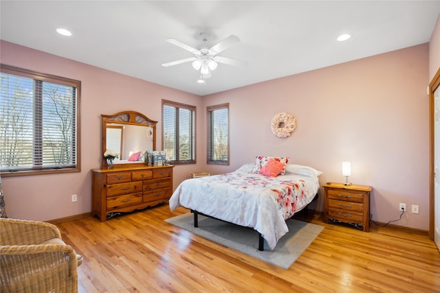 bedroom featuring light wood finished floors, recessed lighting, a ceiling fan, and baseboards