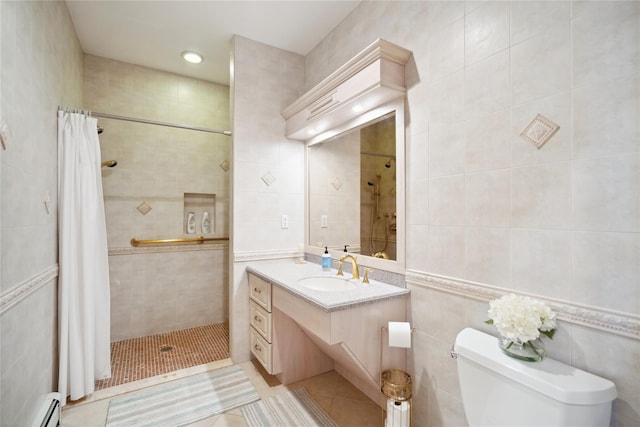 full bathroom with toilet, vanity, tiled shower, tile walls, and a baseboard radiator