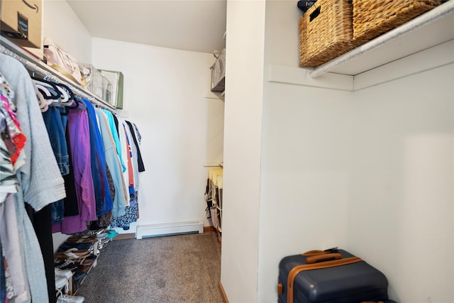 walk in closet featuring carpet flooring and baseboard heating