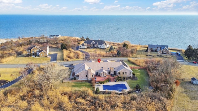 aerial view featuring a residential view and a water view