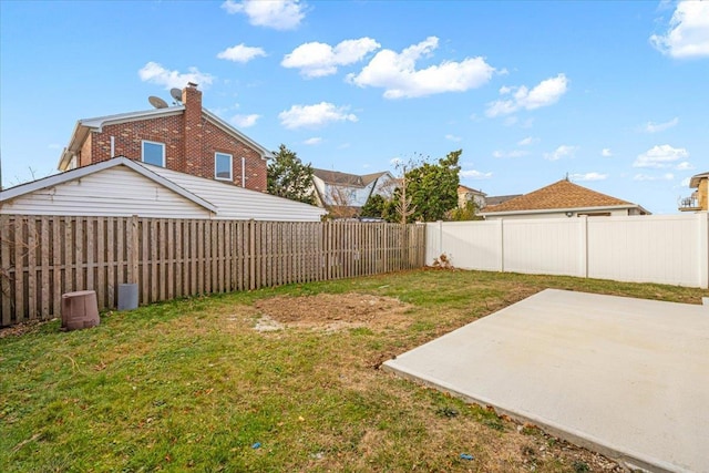 view of yard with a patio area and a fenced backyard