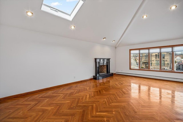 unfurnished living room featuring high vaulted ceiling, a fireplace with raised hearth, a baseboard heating unit, a skylight, and baseboards