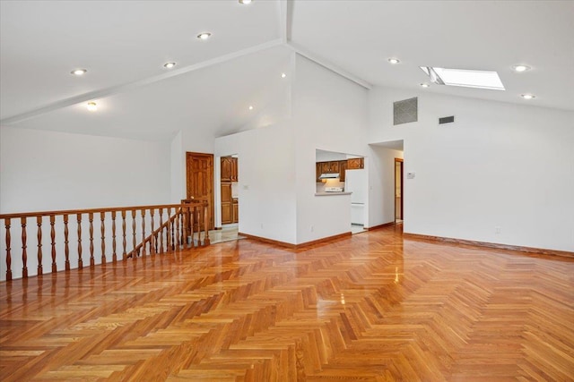 unfurnished room featuring baseboards, visible vents, high vaulted ceiling, a skylight, and recessed lighting