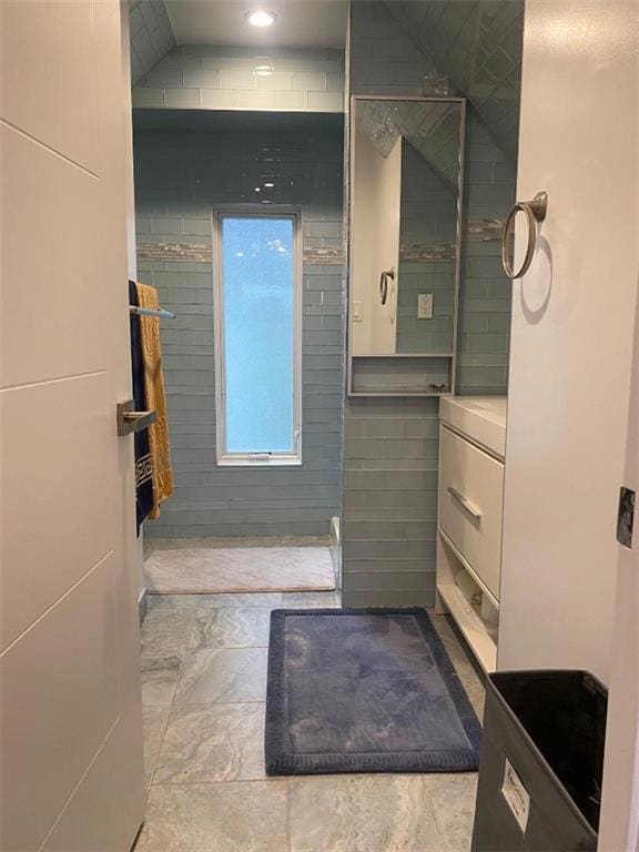 bathroom with tiled shower