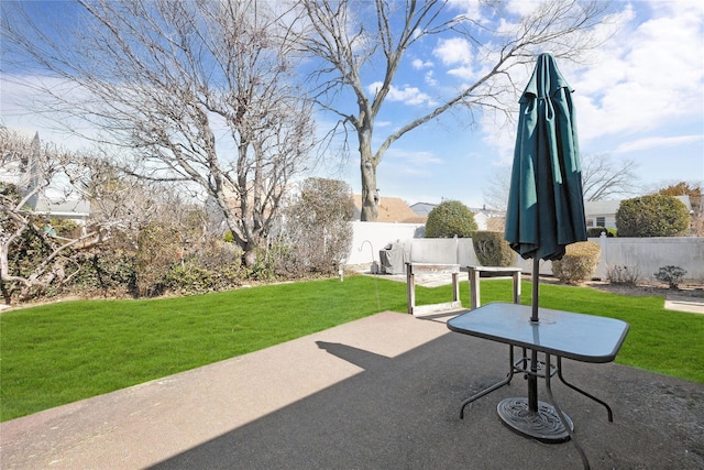 view of patio featuring fence