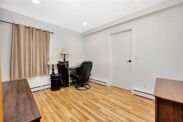 home office with recessed lighting, light wood-type flooring, and a baseboard radiator