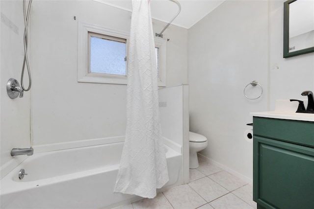 bathroom with vanity, baseboards, tile patterned flooring, toilet, and shower / tub combo with curtain