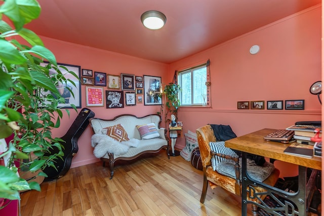 home office featuring wood finished floors and ornamental molding