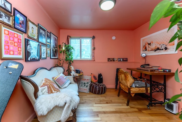 office with wood finished floors and ornamental molding