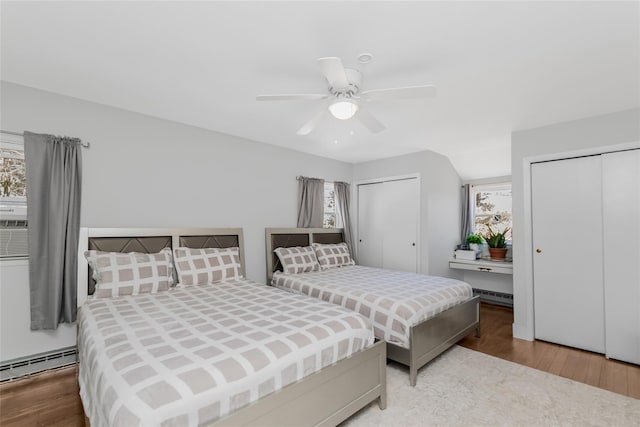 38 Marjorie Dr, Monticello, NY 12701 - bedroom with baseboard heating, multiple closets, and wood finished floors