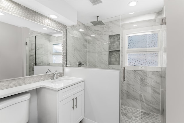 38 Marjorie Dr, Monticello, NY 12701 - bathroom featuring vanity, visible vents, a marble finish shower, recessed lighting, and toilet