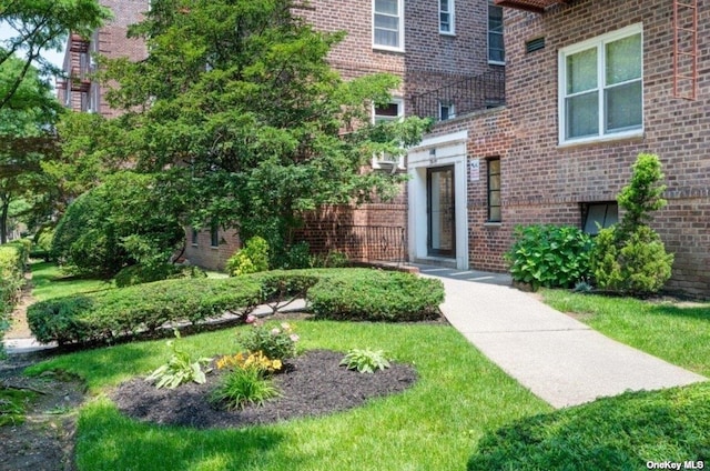 view of exterior entry with brick siding