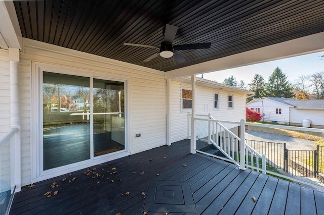 wooden terrace with a ceiling fan