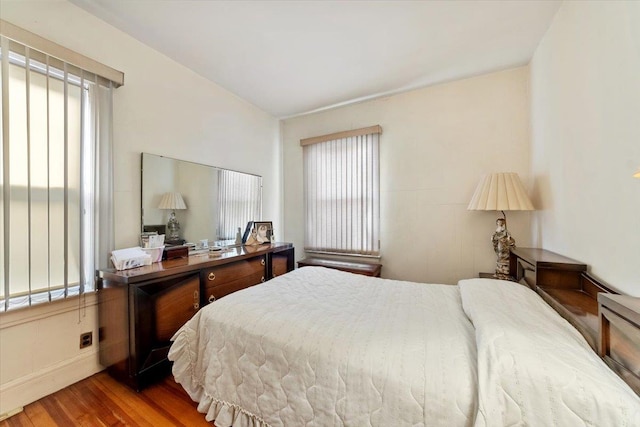 bedroom with wood finished floors