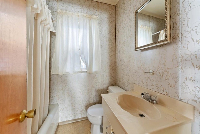 full bathroom featuring vanity, toilet, shower / tub combo, and wallpapered walls