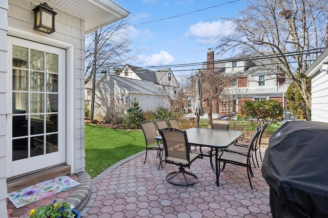 view of patio featuring area for grilling and outdoor dining space