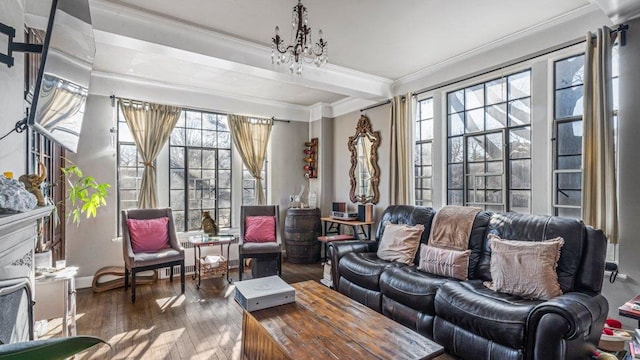 sunroom / solarium with beam ceiling, a notable chandelier, and a healthy amount of sunlight