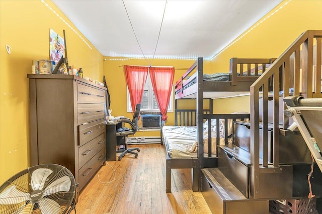 bedroom featuring wood finished floors