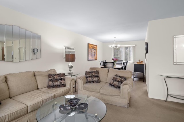 carpeted living area with a notable chandelier and baseboards