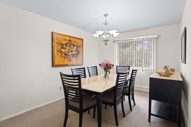 carpeted dining room with baseboards, baseboard heating, and a chandelier