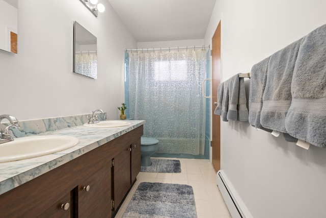 bathroom featuring tile patterned flooring, toilet, a baseboard radiator, and a sink