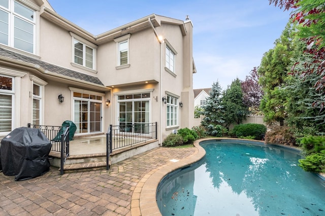 83 Ithaca Ave, Atlantic Beach, NY 11509 - view of swimming pool featuring a patio, fence, a fenced in pool, and area for grilling