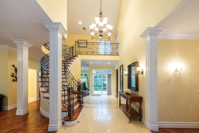 83 Ithaca Ave, Atlantic Beach, NY 11509 - foyer entrance with stairs, ornate columns, crown molding, and a towering ceiling