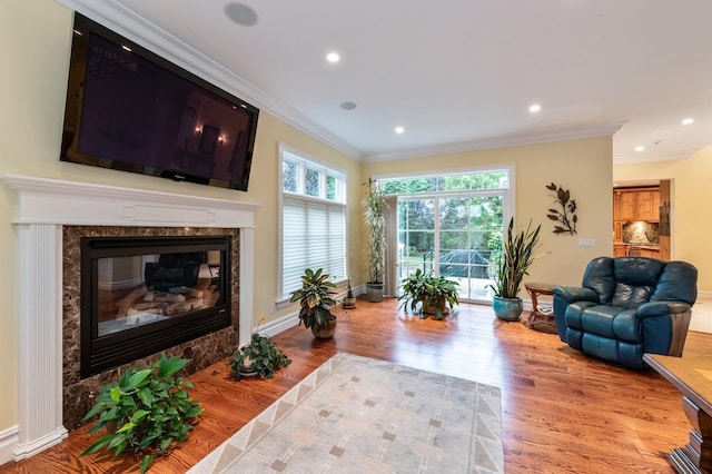 83 Ithaca Ave, Atlantic Beach, NY 11509 - living area with recessed lighting, ornamental molding, baseboards, and wood finished floors