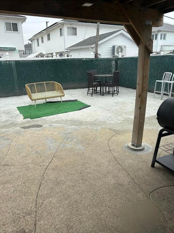 162-30 89th St, Howard Beach, NY 11414 - view of patio / terrace featuring a fenced backyard and outdoor dining space