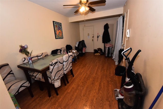 dining room with wood finished floors and a ceiling fan