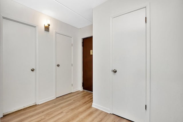 unfurnished bedroom featuring light wood-style flooring