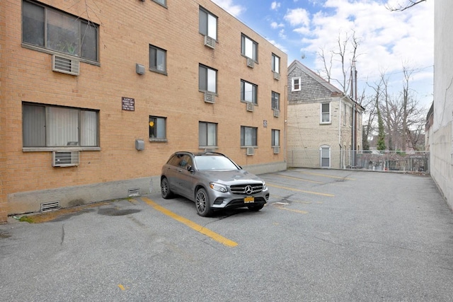 view of property featuring uncovered parking