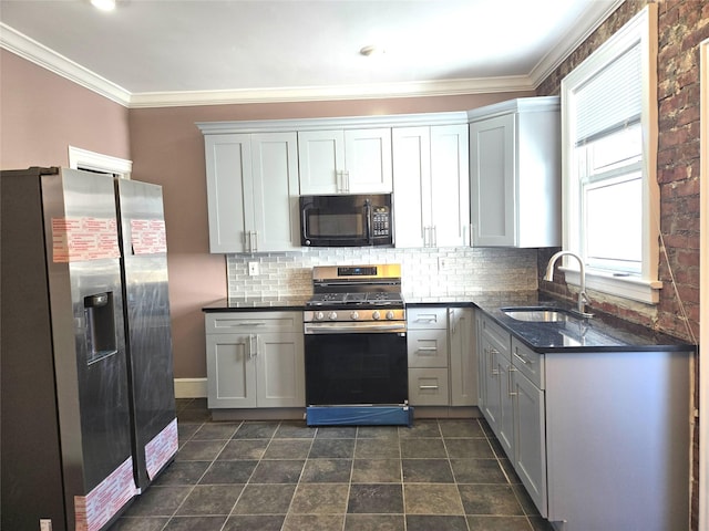 kitchen with gray cabinetry, a sink, appliances with stainless steel finishes, crown molding, and tasteful backsplash