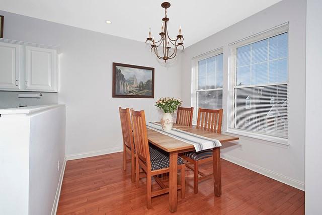 dining space with a chandelier, recessed lighting, light wood-style floors, and baseboards