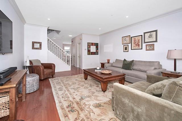 living room featuring recessed lighting, stairway, wood finished floors, and crown molding