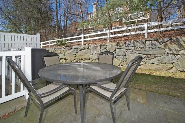 view of patio with outdoor dining space and fence