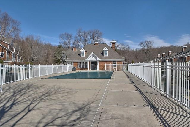 pool featuring a patio area and fence