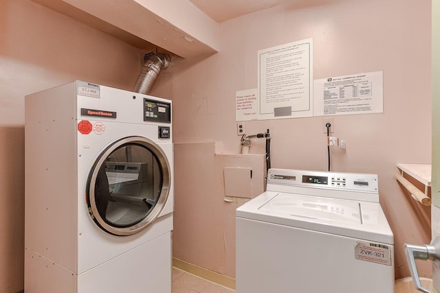 common laundry area with independent washer and dryer