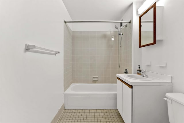 bathroom featuring tile patterned floors, vanity, toilet, and bathing tub / shower combination