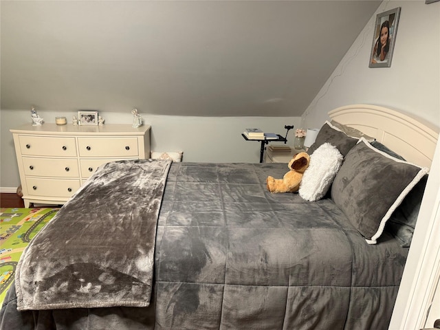 bedroom with vaulted ceiling