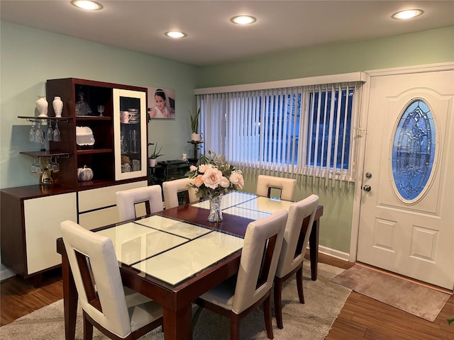 dining space featuring recessed lighting and wood finished floors