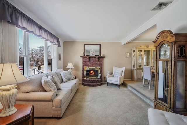 living room featuring visible vents, carpet, crown molding, baseboards, and a brick fireplace