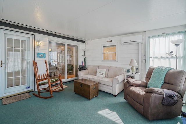 living area featuring a wall mounted air conditioner and carpet floors